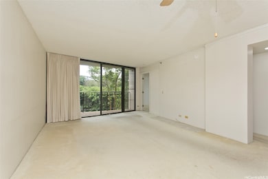 spacious living room with lanai overlooking green space