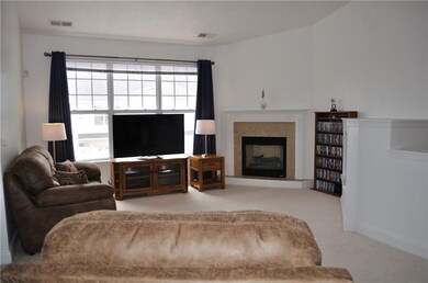 Living Room w/Gas Fireplace & Vaulted Ceiling