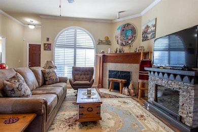 Living room featuring light wood-type flooring, a 