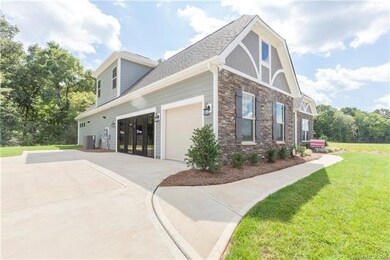 3 car sideload garage.  (Glass doors will be repla