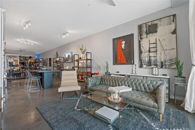 Living area featuring finished concrete floors an