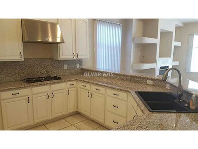 Kitchen. Cook top gas stove. High powered overhead