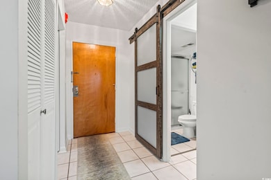 Large Tiled Entry ... shows entry to Bathroom via 