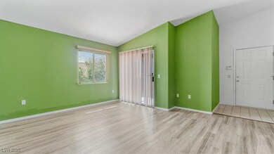 Spare room with vaulted ceiling and wood finished floors
