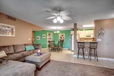 Living room featuring light carpet, ornamental mol