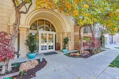 Property entrance with stone siding and french doors