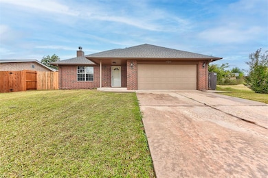 Single story home featuring concrete driveway, brick siding, a shingled roof, a chimney, and an attached garage