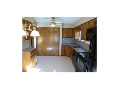 Kitchen with washer & dryer behind doors