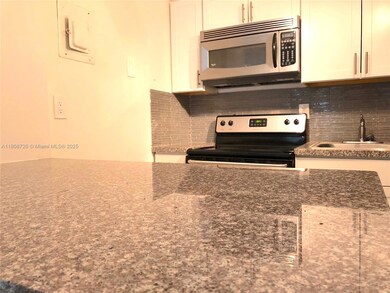 4301 NW South Tamiami Canal Dr unit 3-209, Miami, FL 33126 - photo 2