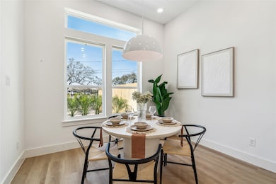 Bright and inviting, this stylish dining space wel
