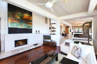 Living Room with fireplace and hand inlaid hardwoo