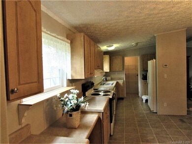 Kitchen has plenty of cabinets! Notice the nice, s