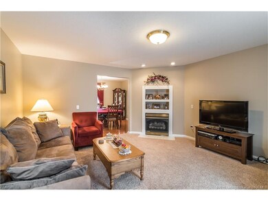 Cozy first floor living room features a fireplace 