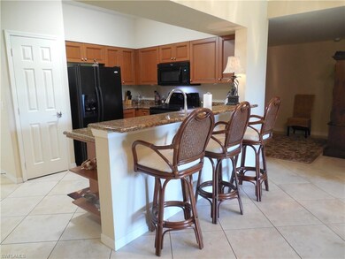 Another view showing the breakfast bar.  Pantry in