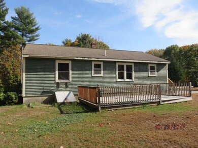 Exterior rear. The deck is in need...