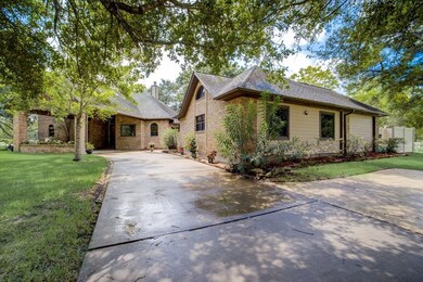 Long driveway leads right up to the covered front entry.