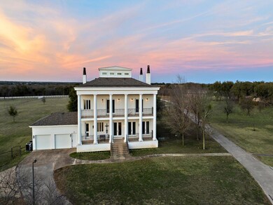 Neoclassical / greek revival house with driveway,