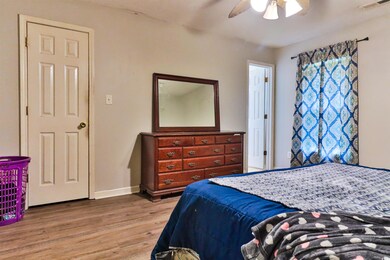 Bedroom with hardwood / wood-style floors and ceil