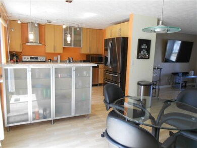 The contemporary kitchen cabinetry provides plenty