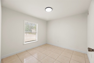 Bedroom 1 features ample natural light and a funct