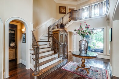 Foyer.  Office to the left, spectacular staircase.
