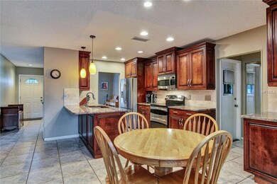 The foyer and dining room lead to the beautifully 