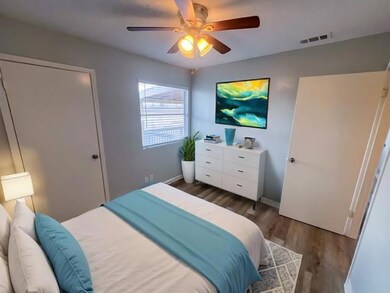 Bedroom featuring visible vents, baseboards, a ce