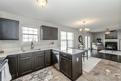 Kitchen with a fireplace, stainless steel applianc