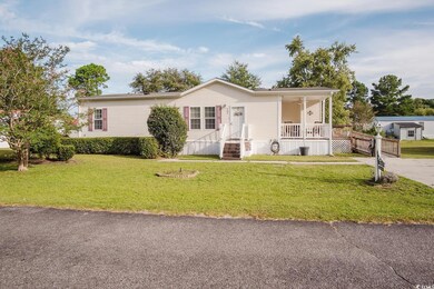View of front of property featuring a front yard a