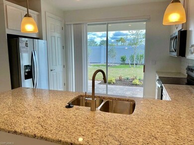 Kitchen with decorative backsplash, appliances wit