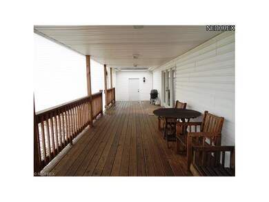 Covered deck located off the Living Room.