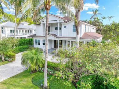 View of front of house featuring a balcony and a front lawn