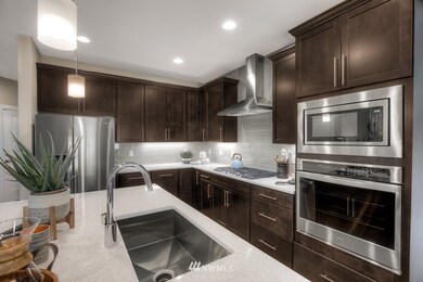 Photo of Newhalem 2 D previously built model home is used for representation purposes. Orientation, colors, design elements, and finish details will vary.