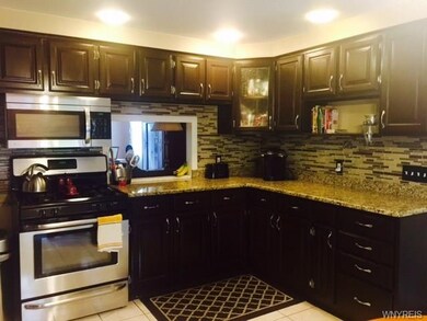 Updated Kitchen w/ Granite and tiled backsplash