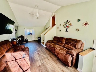 #7- Living room with stairs to kitchen