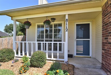 A close up of the main entry and porch. The large