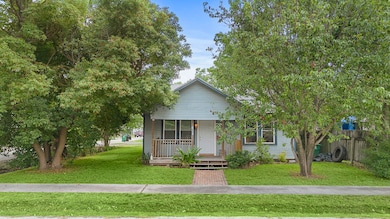Nestled beneath a canopy of mature trees, the exis