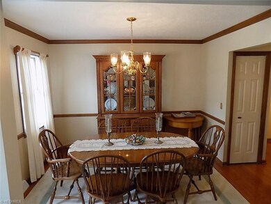 Hardwood floors, crown molding & chair rail.