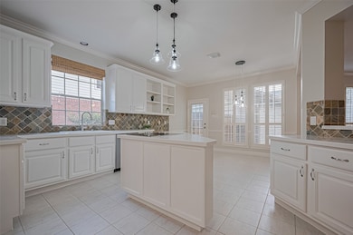 The open-plan kitchen, a culinary haven, is perfec