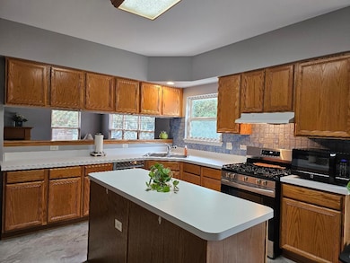 One view of the oversized kitchen. Abundance of co