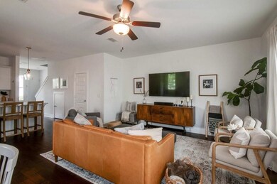 Main living area features a half bathroom off the living room.