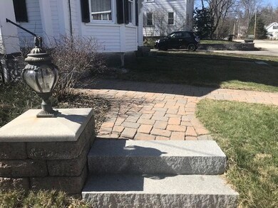 This tasteful lighted  entrance brings you to this impeccable home.