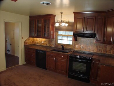 Another shot of the kitchen.  The stove hood is di