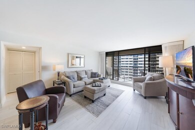 Living area featuring a wall of windows