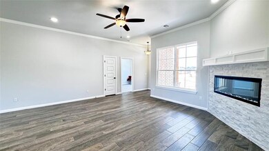 Unfurnished living room featuring ceiling fan, a s