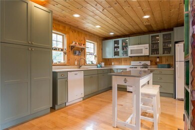 An oversized pantry cabinet provides...