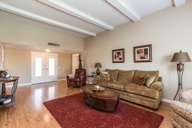 Living Room with Beam Ceiling