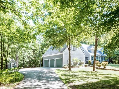 Impressive 3-car garage plus shed...