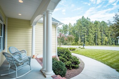 Full concrete porch is the perfect place for watching the world go by.