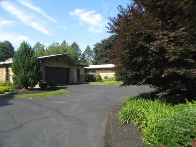The over sized two car garage has shelves and stor